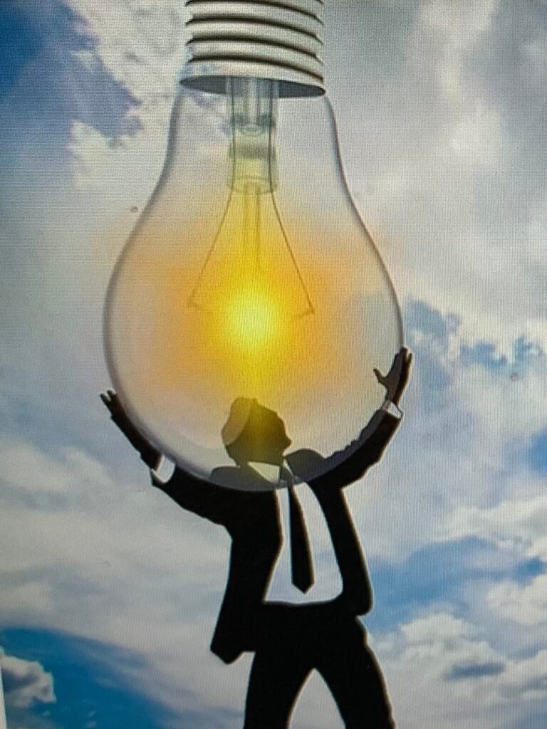 man-holding-a-lightbulb Man holding a lightbulb for blog post We’re making the Bible easier to understand so people can know God!