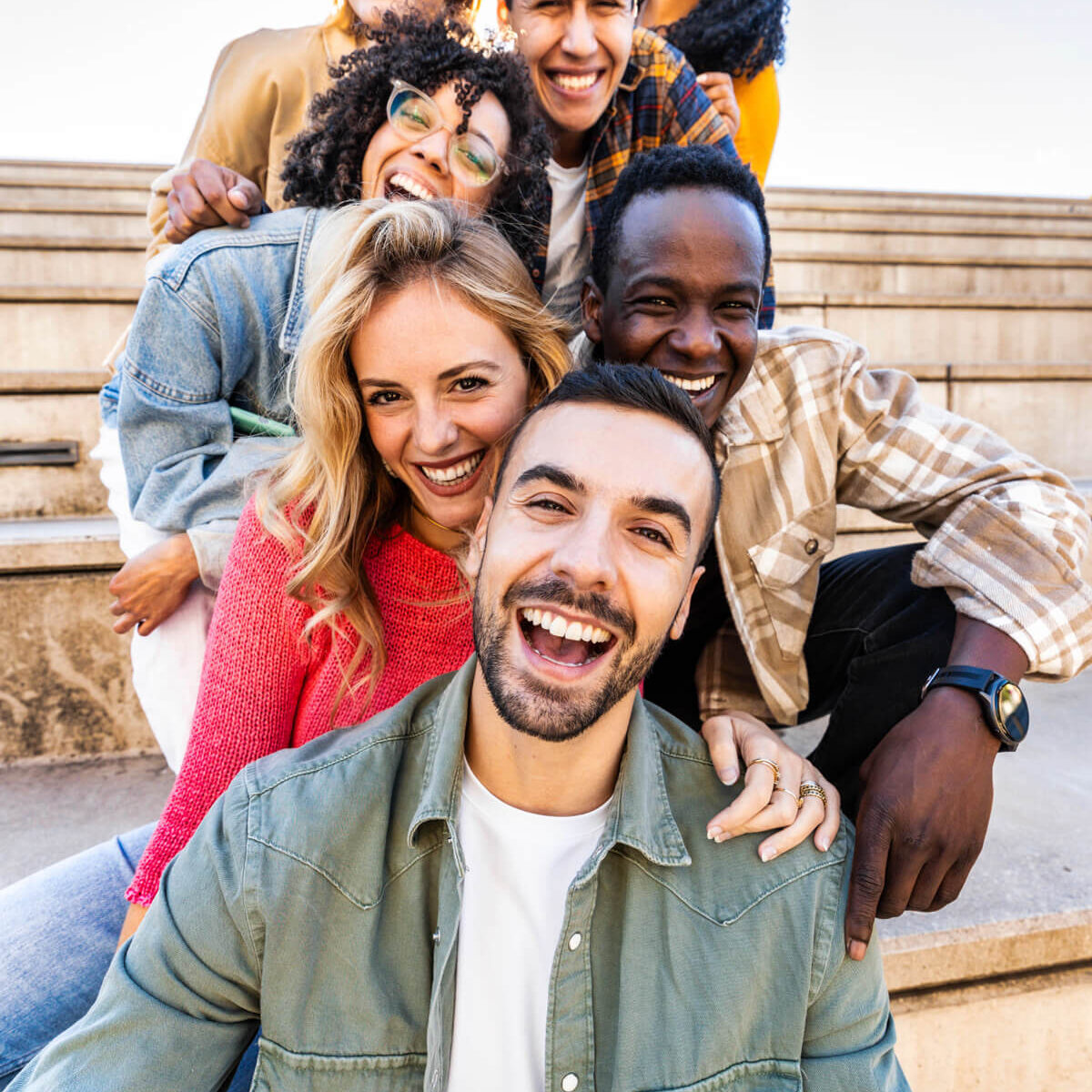 group-of-people-smiling-stairs Group of people smiling on stairs